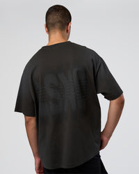 Man wearing Spray Heavyweight Unisex Oversized Tee - Charcoal Washed | Model:Zoran | Size:M