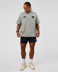 Man wearing Static Grit Heavyweight Oversized Tee - Alloy-Black | Model:Malebo | Size:M