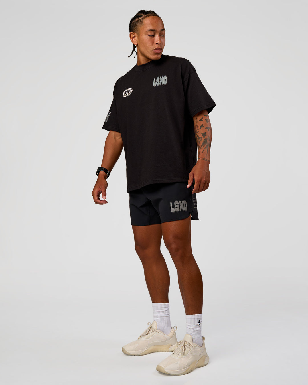 Man wearing Static Grit Heavyweight Oversized Tee - Black-Alloy | Model:Malebo | Size:M