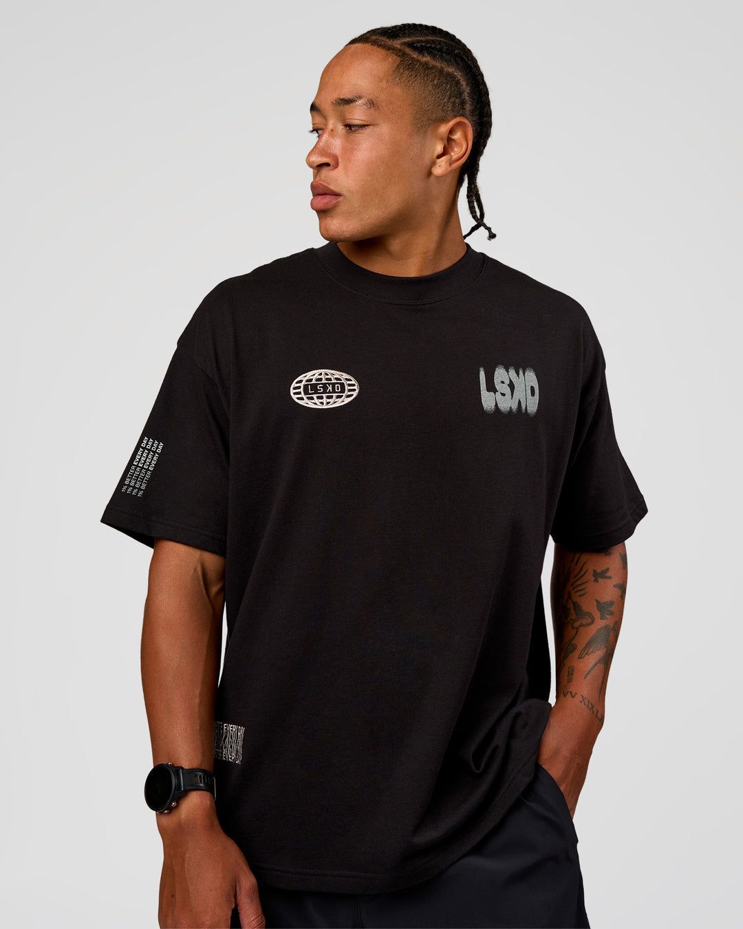 Man wearing Static Grit Heavyweight Oversized Tee - Black-Alloy | Model:Malebo | Size:M