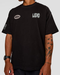 Man wearing Static Grit Heavyweight Oversized Tee - Black-Alloy | Model:Malebo | Size:M