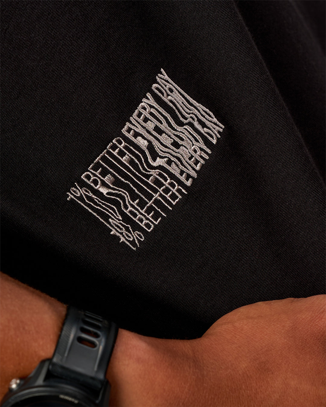 Man wearing Static Grit Heavyweight Oversized Tee - Black-Alloy | Model:Malebo | Size:M