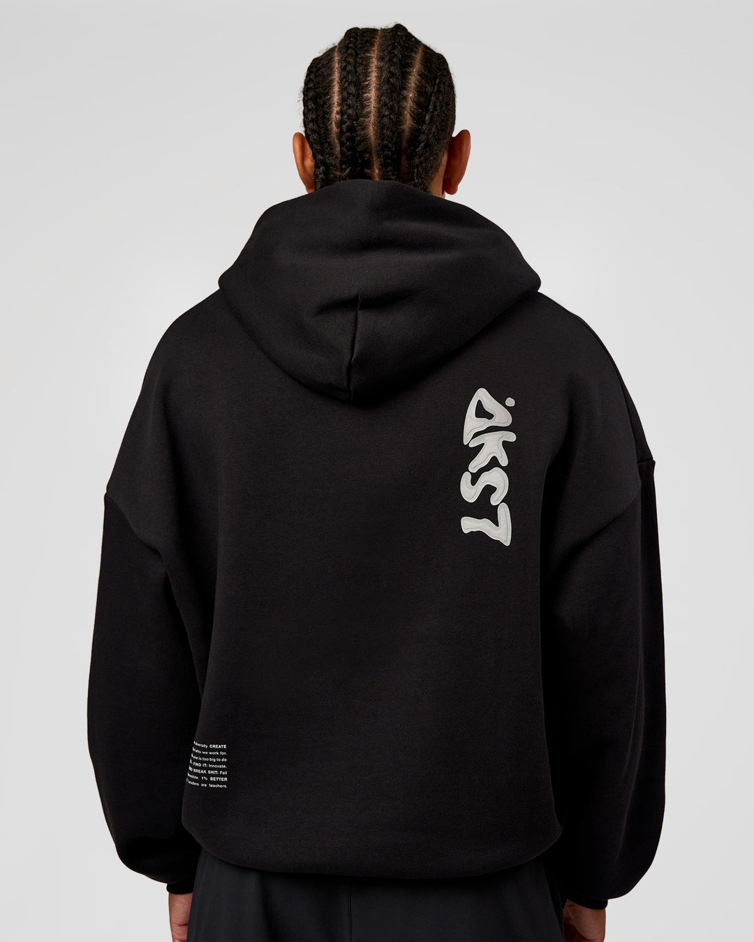 Man wearing Static Grit Unisex Boxy Hoodie - Black-Alloy | Model:Malebo | Size:M