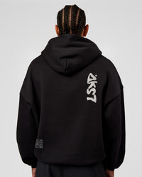 Man wearing Static Grit Unisex Boxy Hoodie - Black-Alloy | Model:Malebo | Size:M