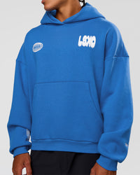Man wearing Static Grit Unisex Boxy Hoodie - Palace Blue-White | Model:Malebo | Size:M