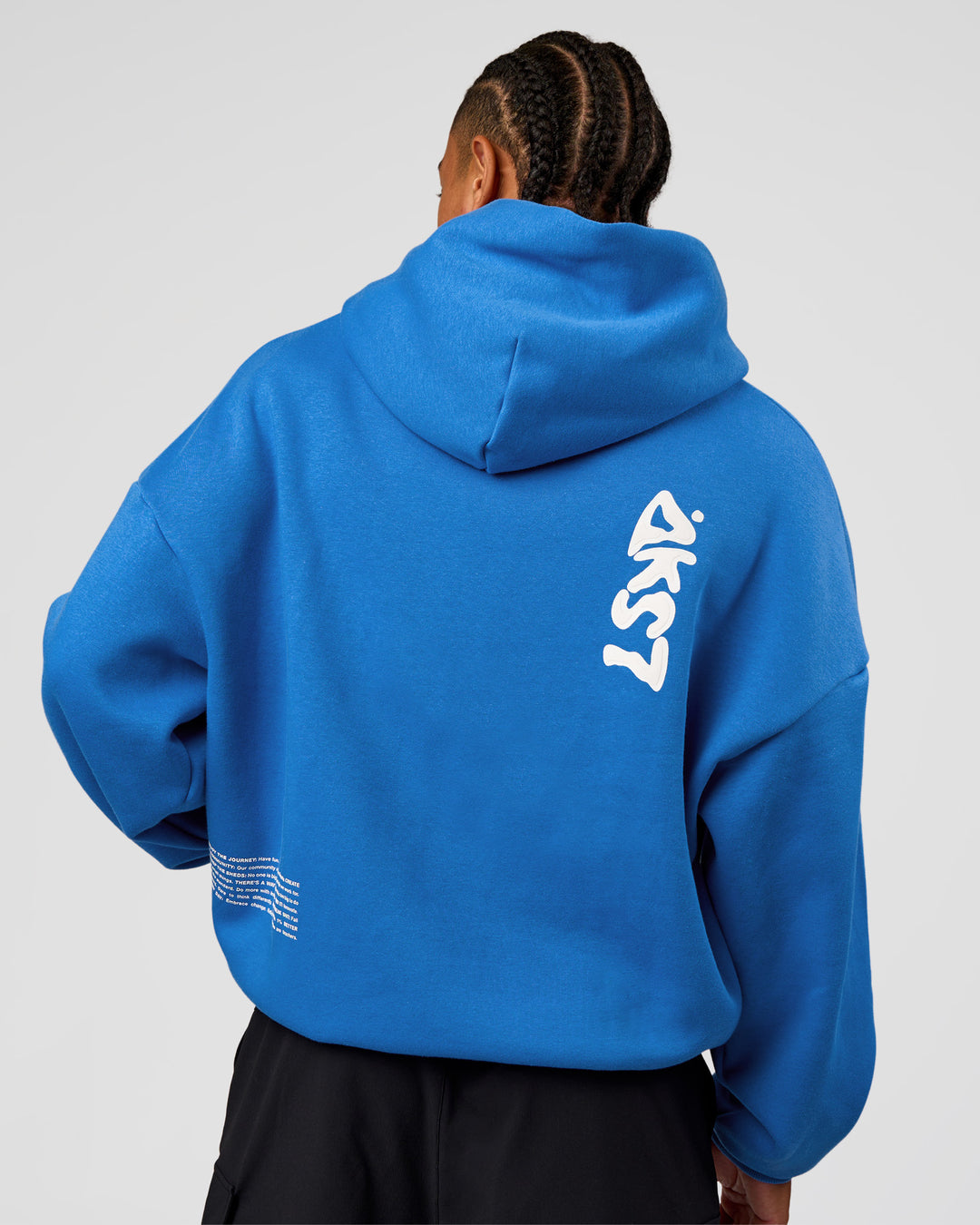Man wearing Static Grit Unisex Boxy Hoodie - Palace Blue-White | Model:Malebo | Size:M