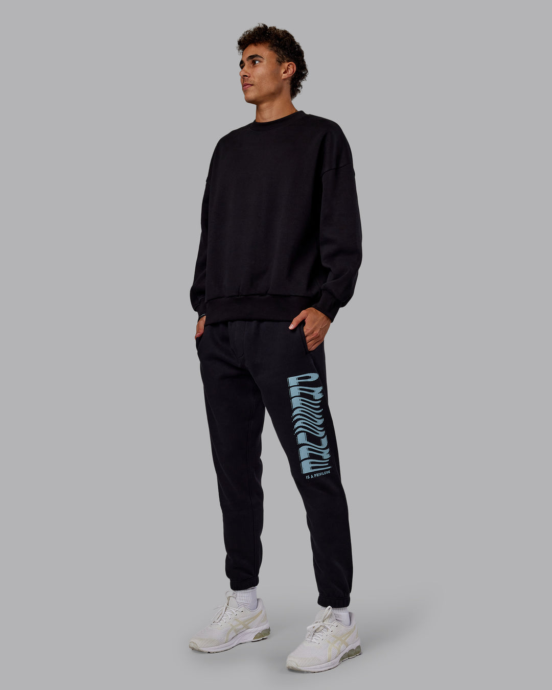 Man wearing Static Track Pant - Black-Skyride | Model:Jaxon | Size:M