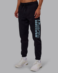 Man wearing Static Track Pant - Black-Skyride | Model:Jaxon | Size:M