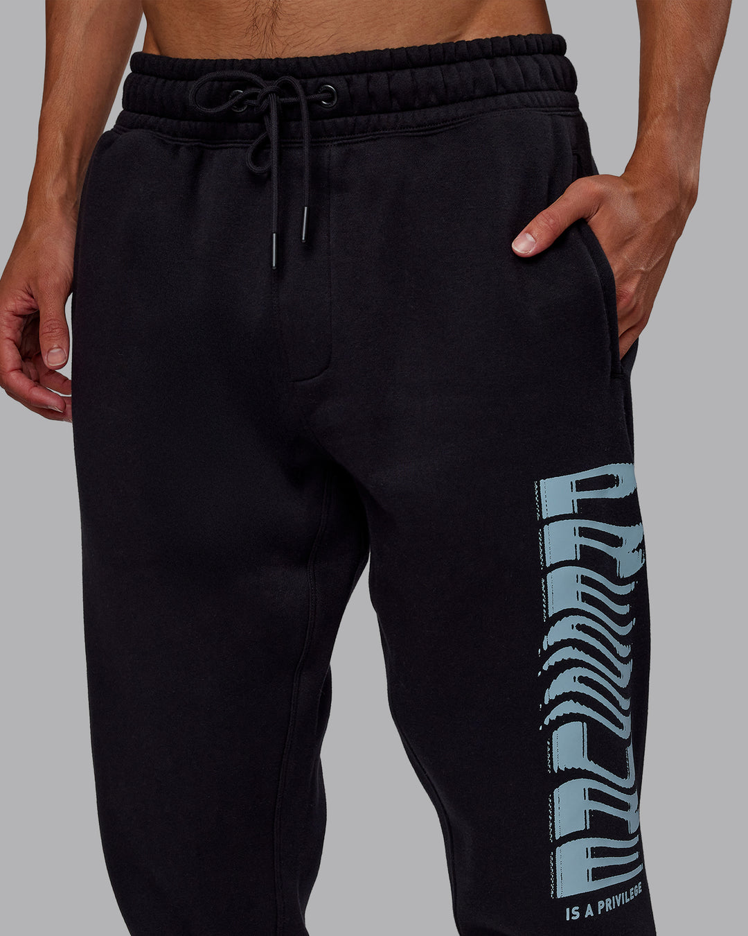 Man wearing Static Track Pant - Black-Skyride | Model:Jaxon | Size:M