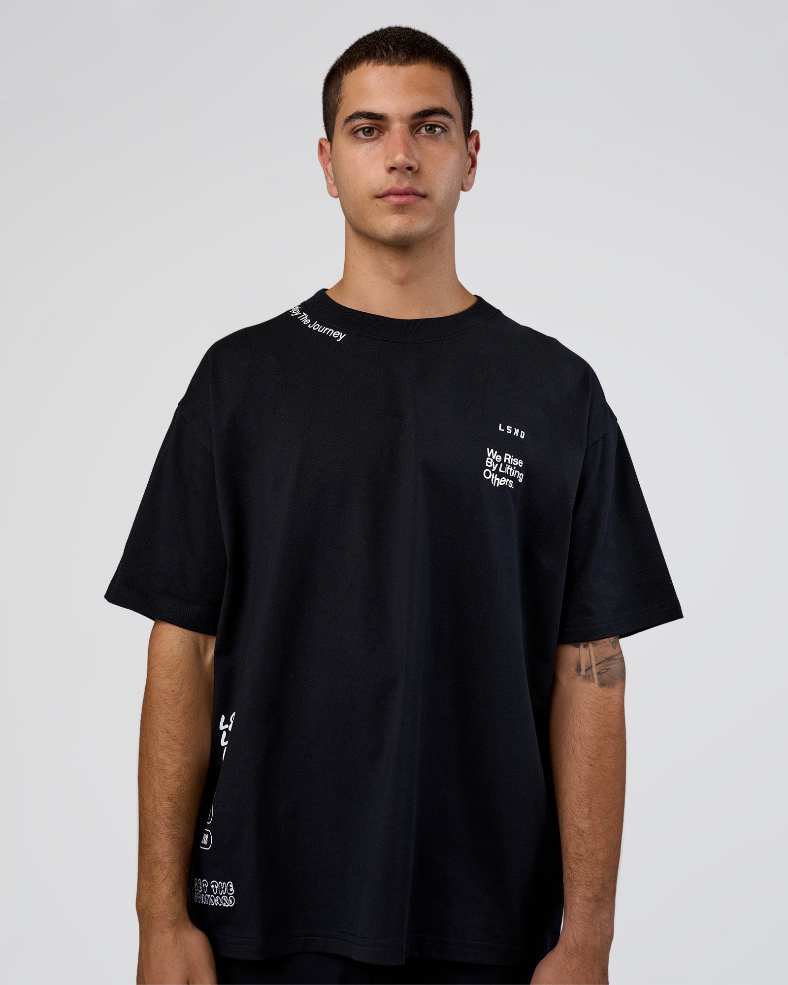 Man wearing Sticker Heavyweight Oversized Tee - Black-White | Model:Zoran | Size:M