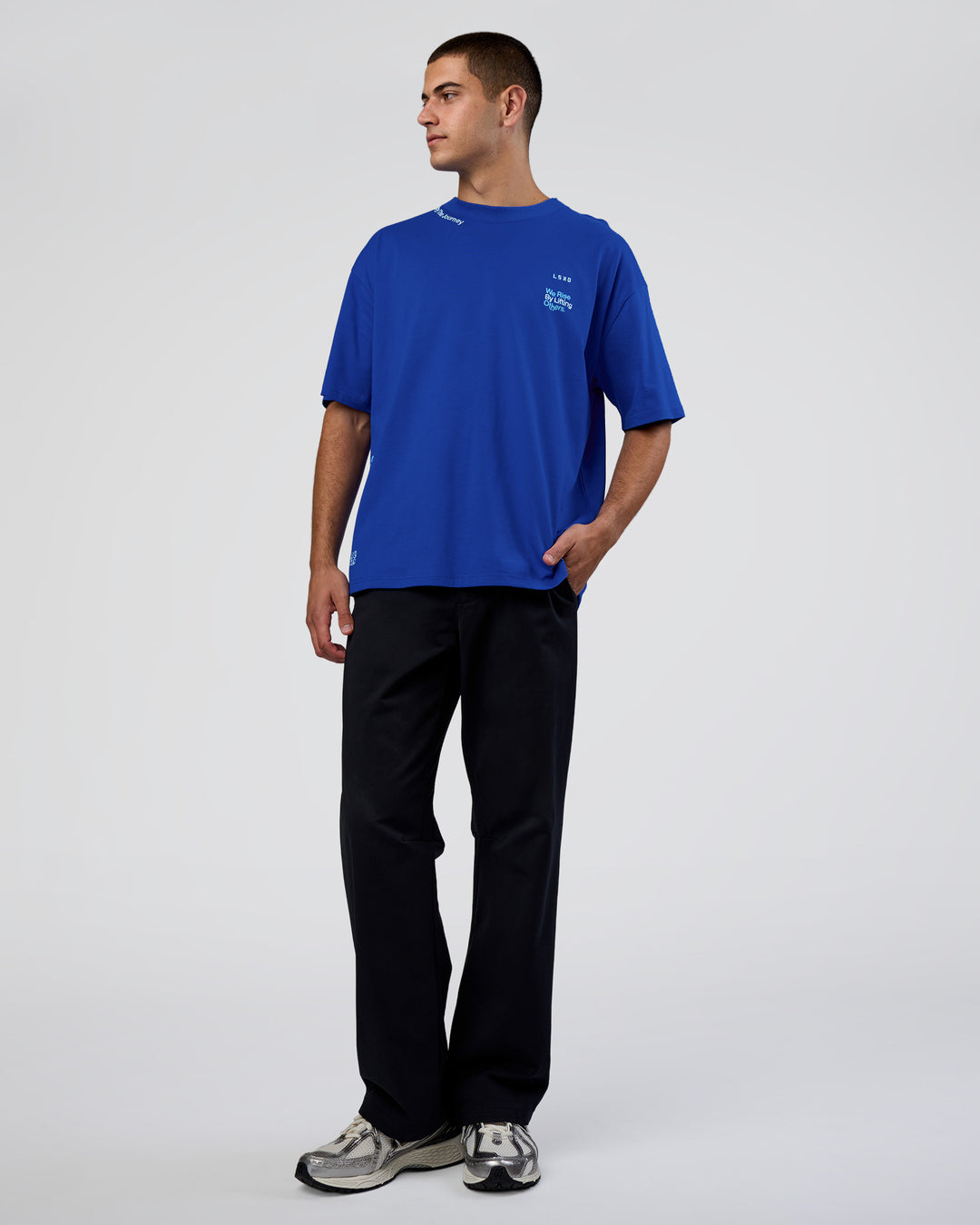 Man wearing Sticker Heavyweight Oversized Tee - Electric Indigo-Baltic Sea | Model:Zoran | Size:M