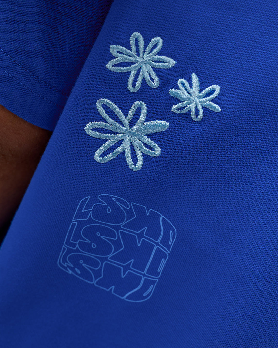 Man wearing Sticker Heavyweight Oversized Tee - Electric Indigo-Baltic Sea | Model:Zoran | Size:M