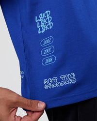 Man wearing Sticker Heavyweight Oversized Tee - Electric Indigo-Baltic Sea | Model:Zoran | Size:M