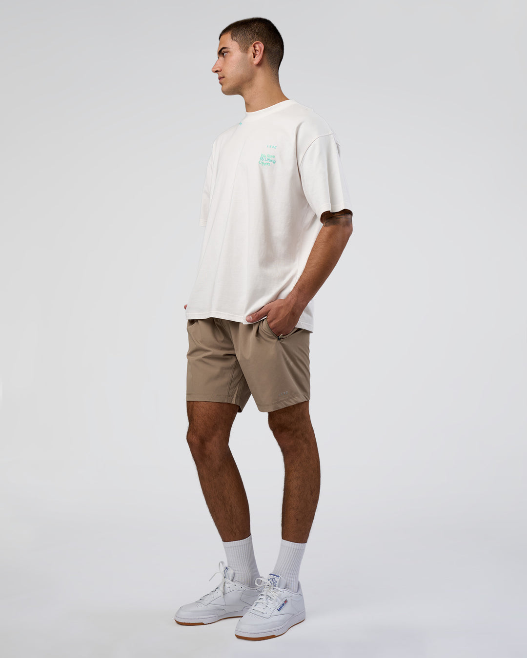 Man wearing Sticker Heavyweight Oversized Tee - Off White-Jelly Mint | Model:Zoran | Size:M