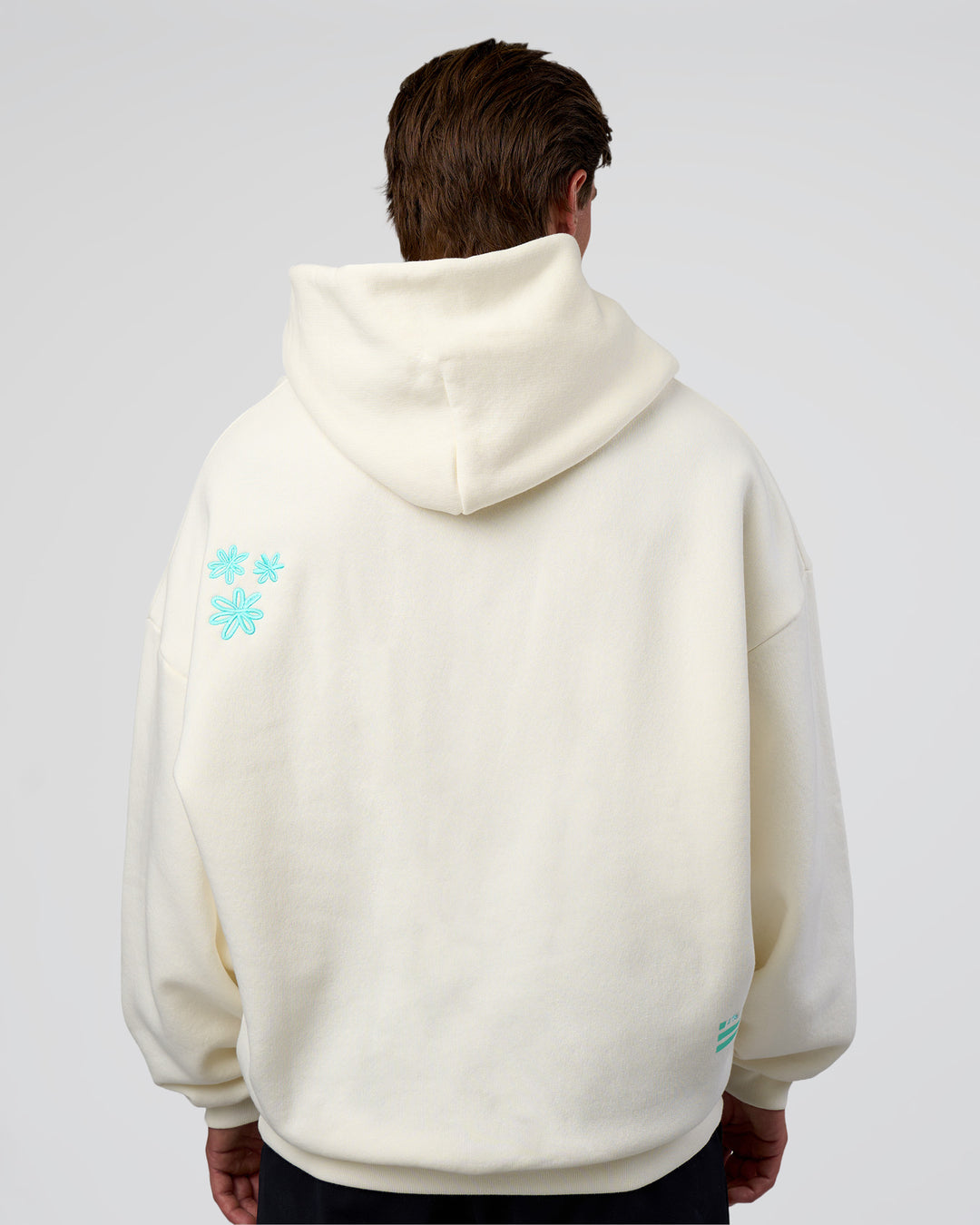 Man wearing Sticker Unisex Oversized Hoodie - Off White-Jelly Mint | Model:Konnor | Size:M