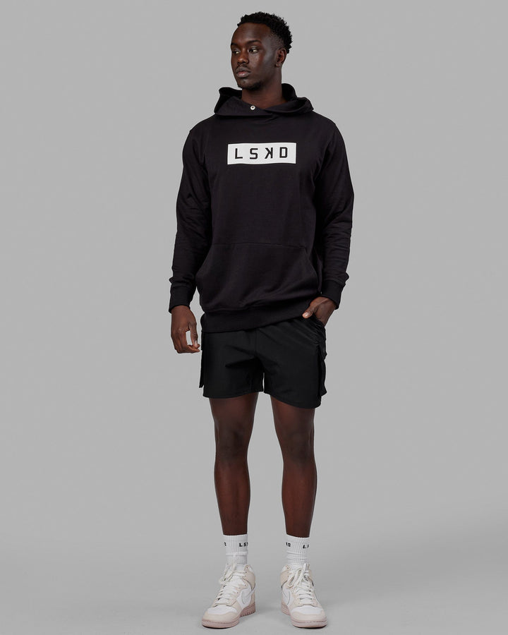 Man wearing Unisex Strength FLXFLeece Hoodie - Black-White