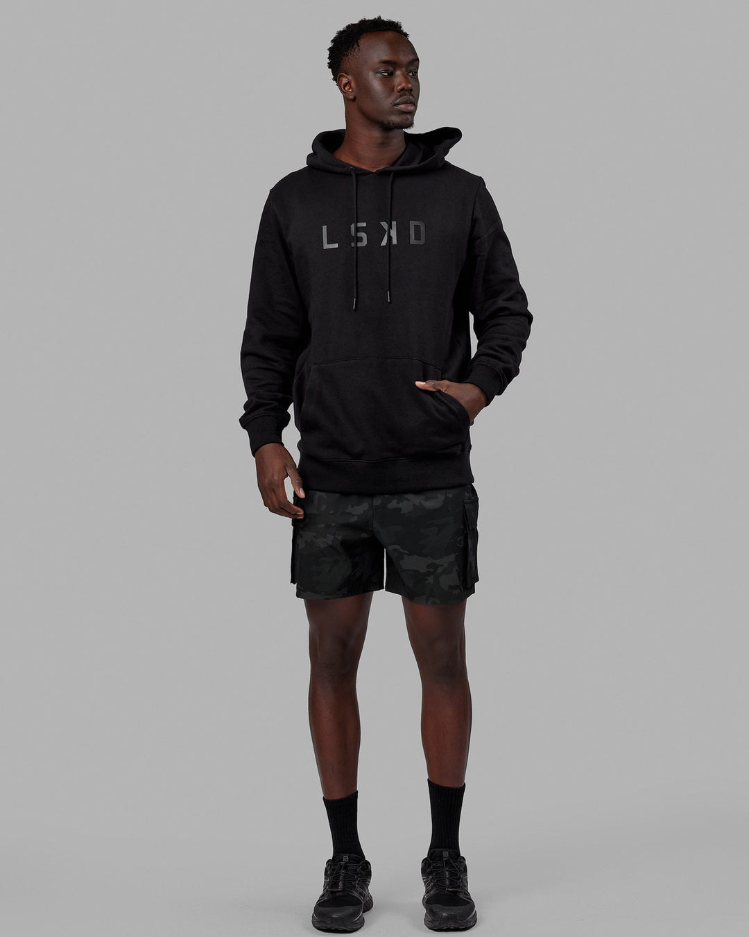 Man wearing Unisex Structure Hoodie - Black-Black