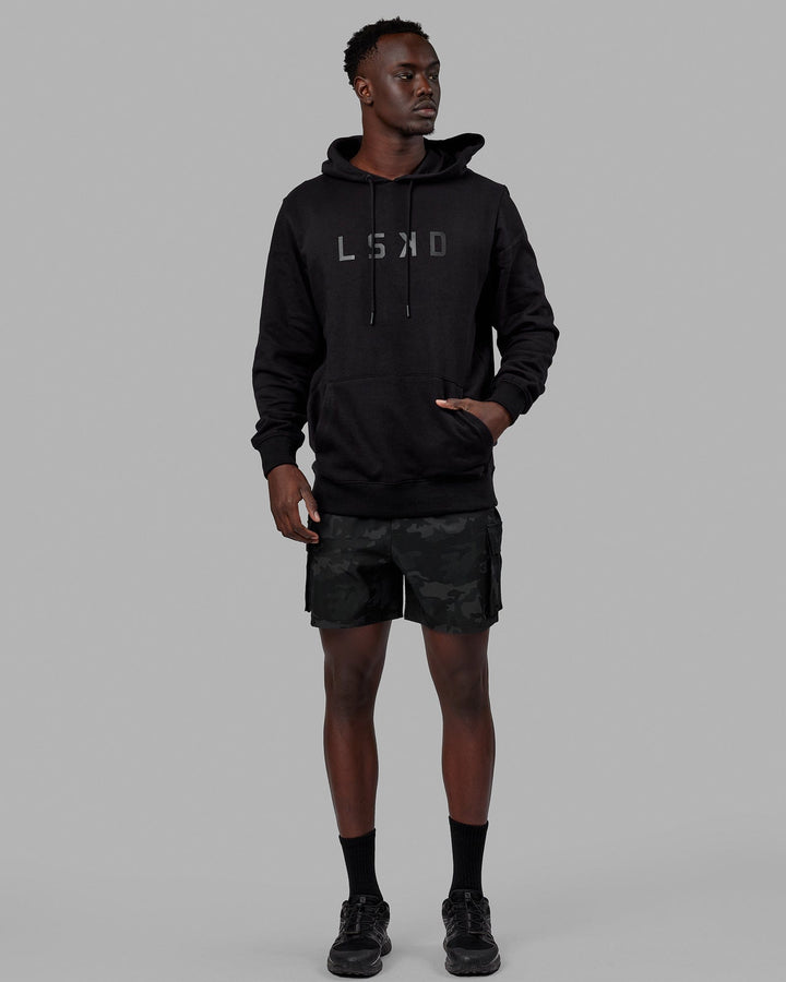 Man wearing Unisex Structure Hoodie - Black-Black