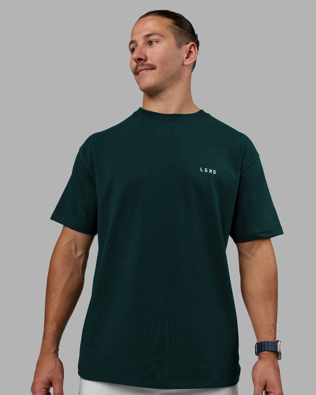 Man wearing Think Strong Heavyweight FLXCotton Tee Oversize - Dark Moss-Off White | Model:Jaiden | Size:M