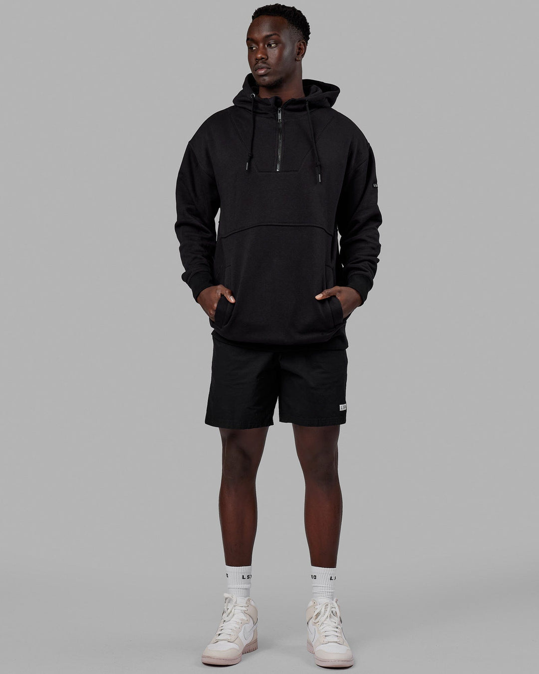 Man wearing Unisex Trek Hoodie Oversize - Black