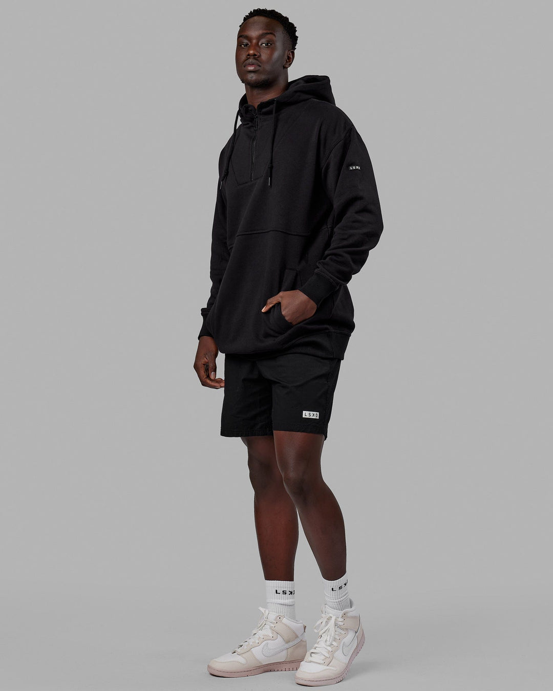 Man wearing Unisex Trek Hoodie Oversize - Black
