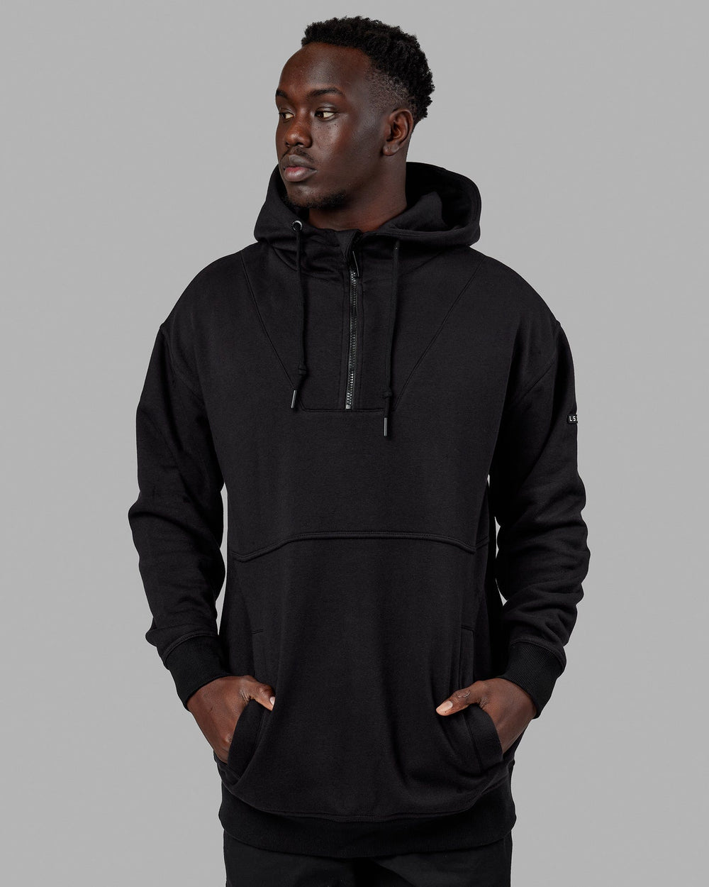 Man wearing Unisex Trek Hoodie Oversize - Black