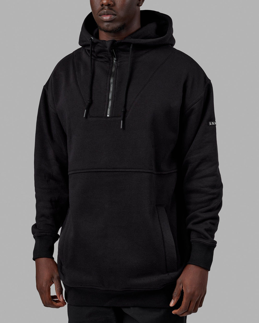 Man wearing Unisex Trek Hoodie Oversize - Black