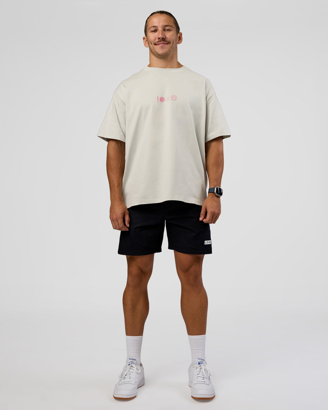 Man wearing Trust The Process Heavyweight Unisex Oversized Tee - Digital Mist-Ultra Pink | Model:Jaiden | Size:M