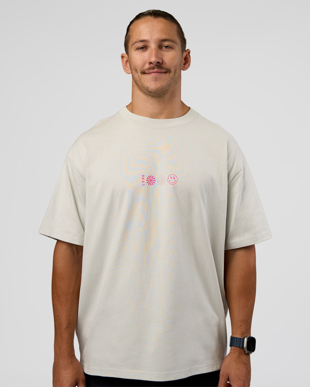 Man wearing Trust The Process Heavyweight Unisex Oversized Tee - Digital Mist-Ultra Pink | Model:Jaiden | Size:M