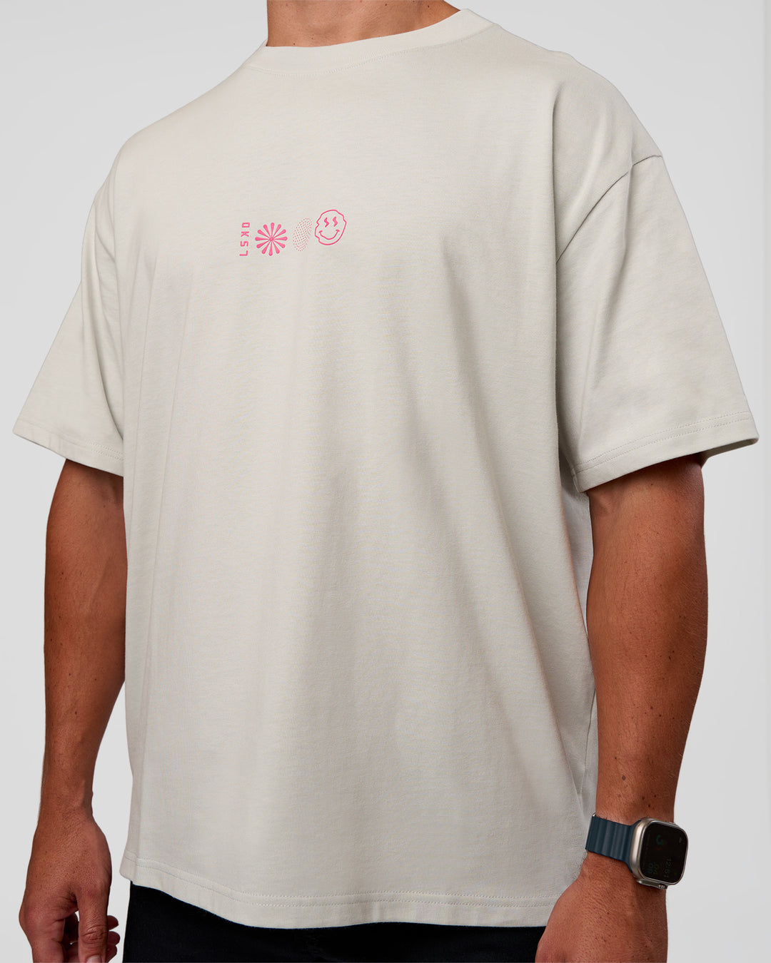 Man wearing Trust The Process Heavyweight Unisex Oversized Tee - Digital Mist-Ultra Pink | Model:Jaiden | Size:M