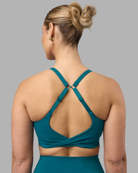 Woman wearing Twist Sports Bra D/DD/E - Blue Coral | Model:Amy | Size:M