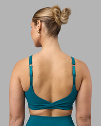 Woman wearing Twist Sports Bra D/DD/E - Blue Coral | Model:Amy | Size:M