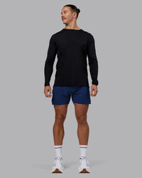 Man wearing UltraAir 5" Lined Performance Short - Midnight Blue | Model:Jaiden | Size:M