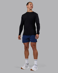 Man wearing UltraAir 5" Lined Performance Short - Midnight Blue | Model:Jaiden | Size:M