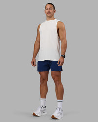 Man wearing UltraAir 5" Lined Performance Short - Midnight Blue | Model:Jaiden | Size:M