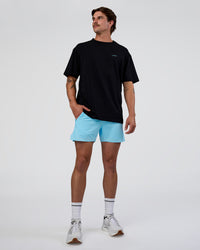 Man wearing Unfit Club FLXCotton Oversized Tee - Black-White | Model:Konnor | Size:M