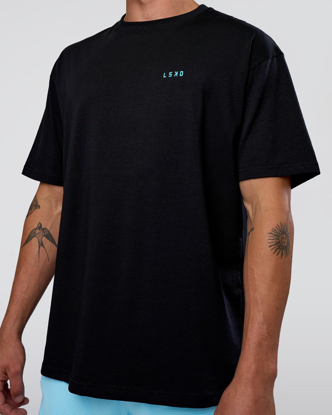 Man wearing Unfit Club FLXCotton Oversized Tee - Black-White | Model:Konnor | Size:M