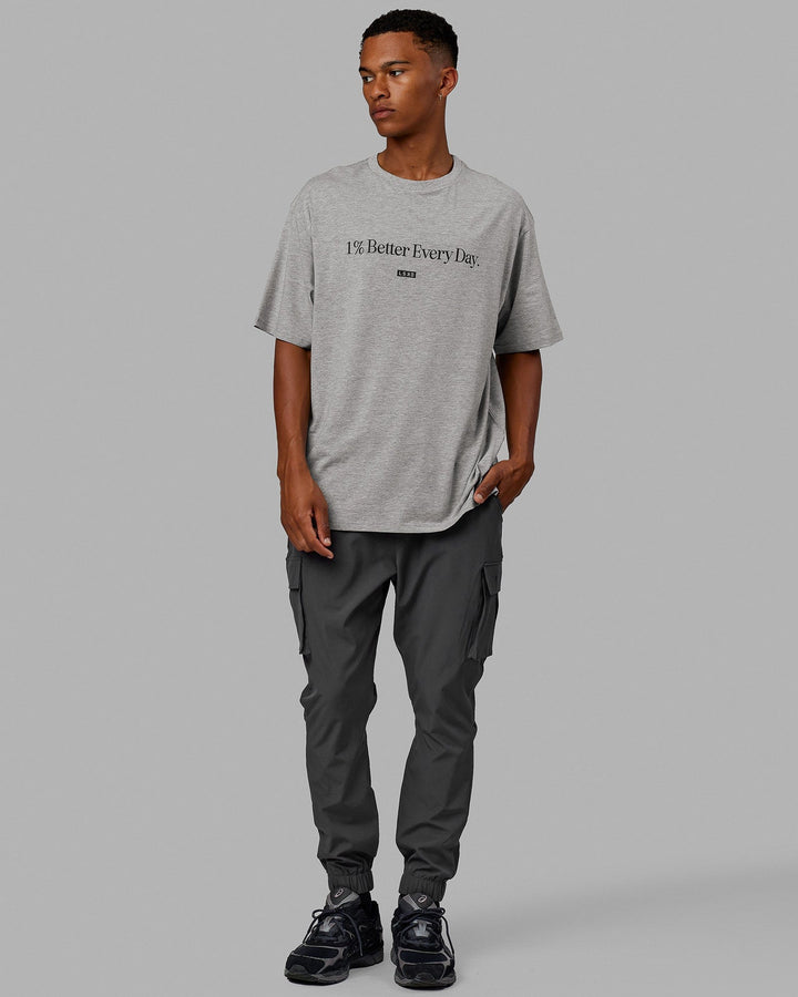 Man  wearing Unisex 1% Better FLXCotton Tee Oversize - Lt Grey Marl-Black