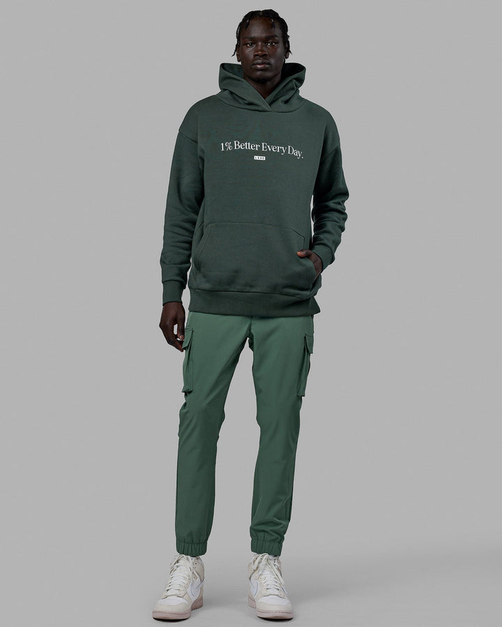 Man wearing Unisex 1% Better Hoodie Oversize - Vital Green