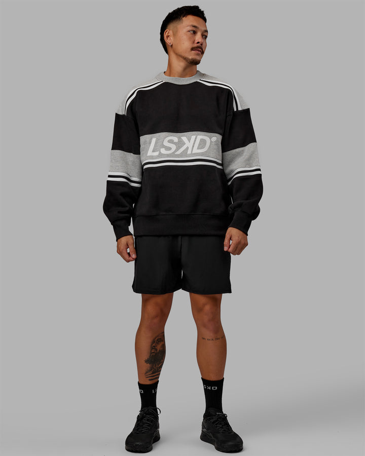 Man wearing Unisex A-Team Sweater Oversize - Black-Light Grey Marl