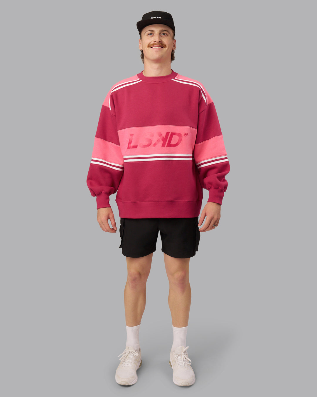 Man wearing A-Team Sweater Oversize - Vivacious-Hot Pink | Model:Isaac | Size:M