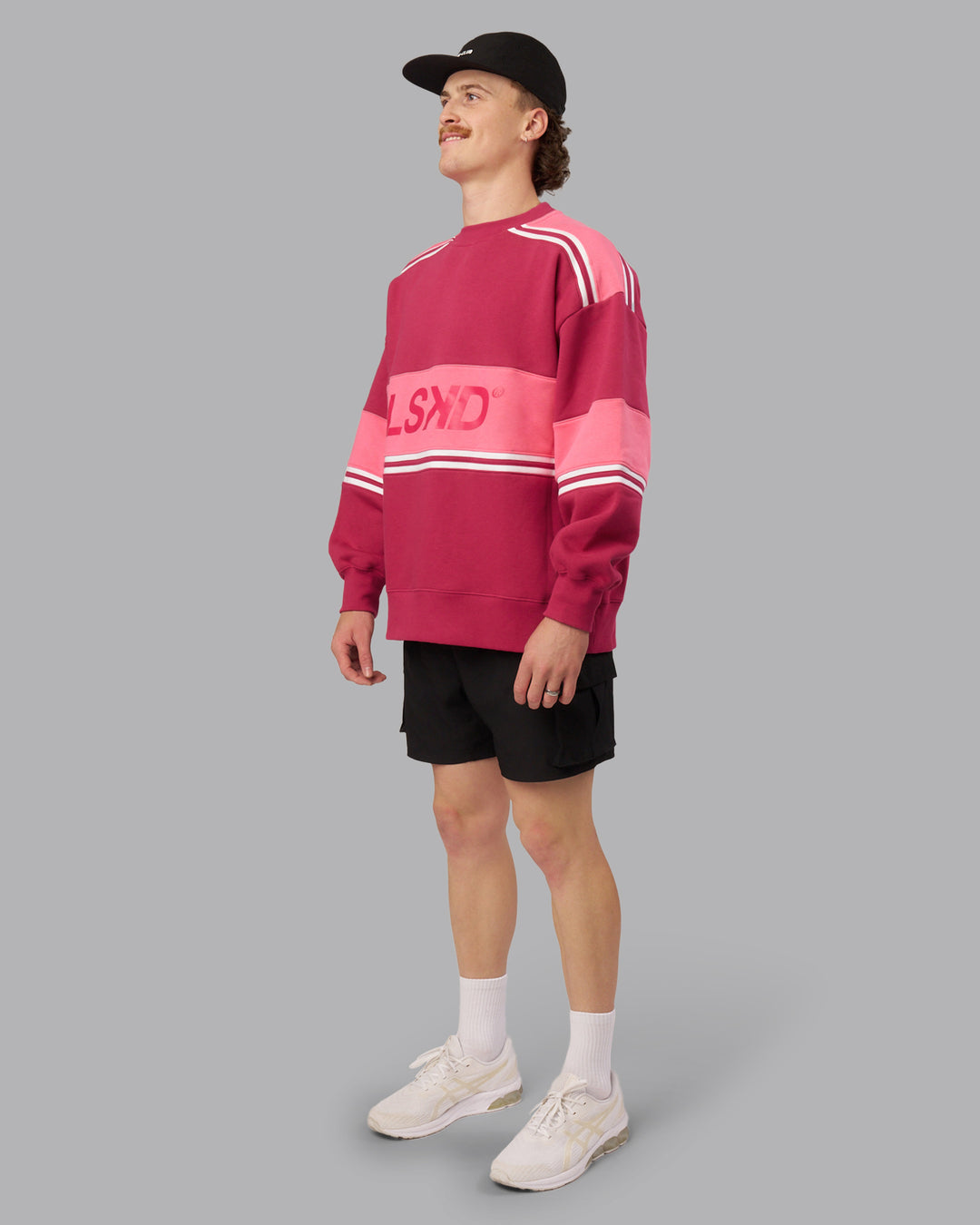 Man wearing A-Team Sweater Oversize - Vivacious-Hot Pink | Model:Isaac | Size:M