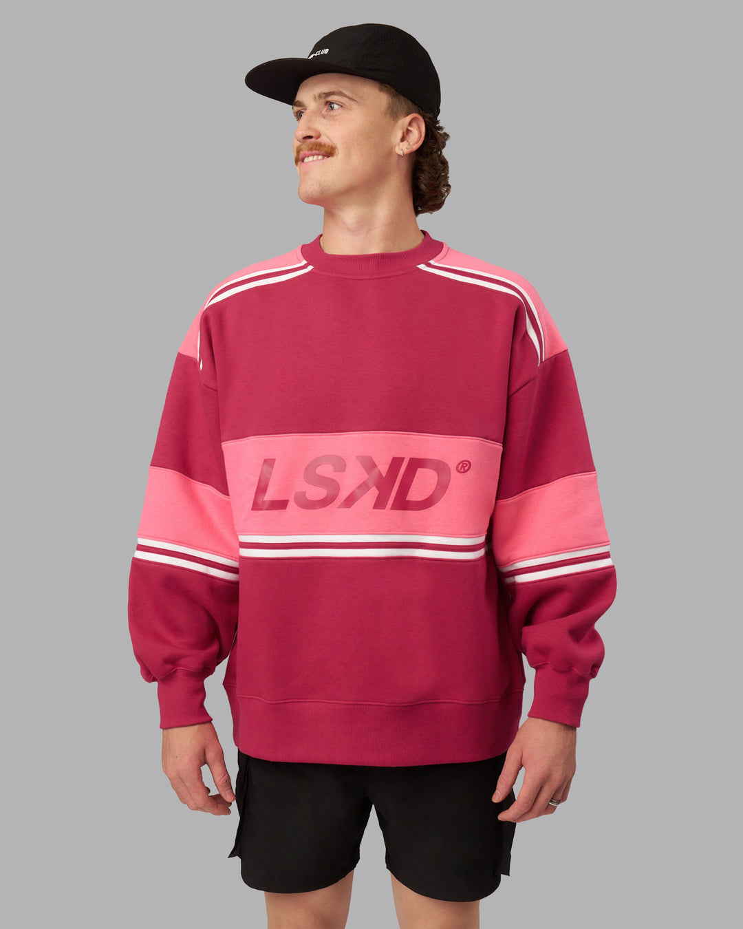 Man wearing A-Team Sweater Oversize - Vivacious-Hot Pink | Model:Isaac | Size:M