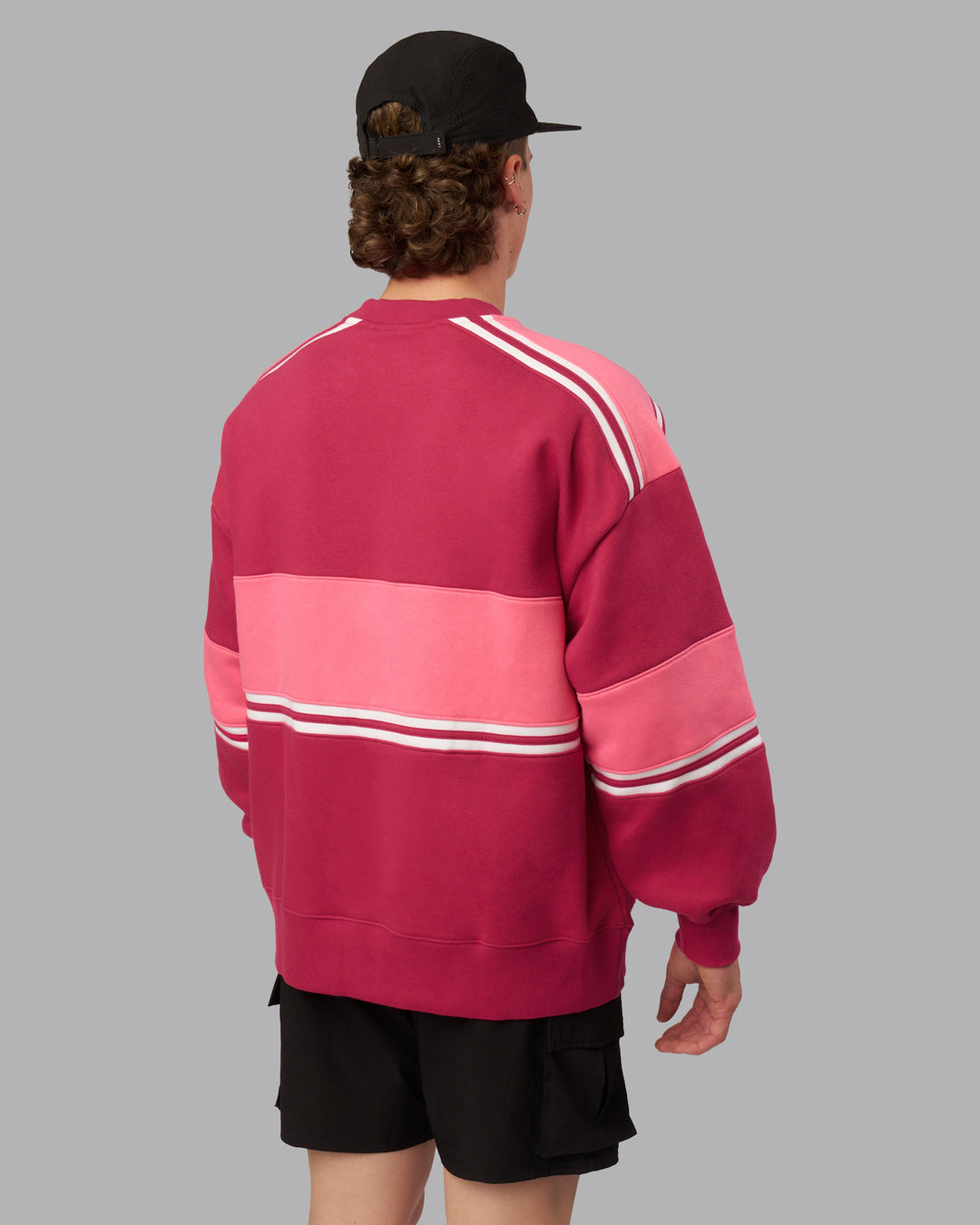 Man wearing A-Team Sweater Oversize - Vivacious-Hot Pink | Model:Isaac | Size:M