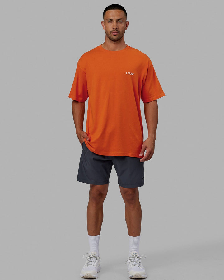 Man wearing Unisex Endeavour Heavyweight Tee Oversize - Impact Orange