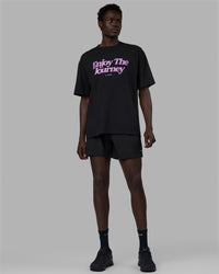 Man wearing Unisex Enjoy The Journey FLXCotton Tee Oversize - Black-Light Violet