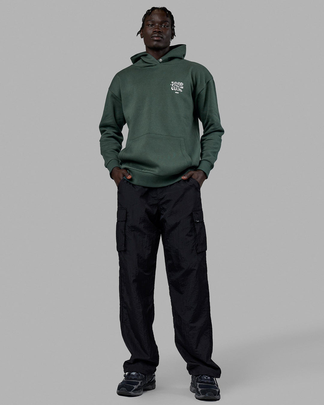 Man wearing Unisex Good Times Hoodie Oversize - Vital Green