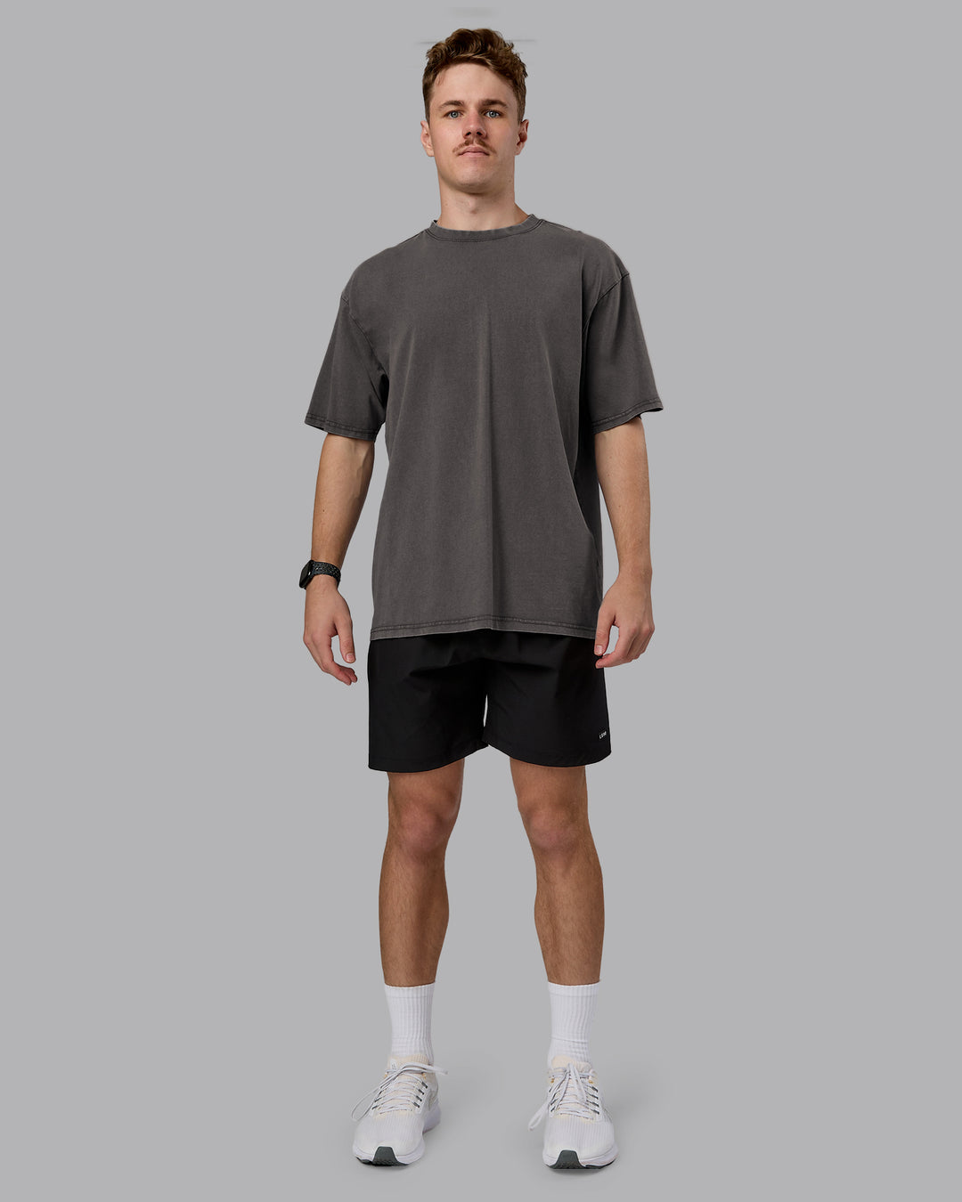 Man wearing Heart FLXCotton Oversized Tee - Washed Dark Storm-Violet Ray | Model:Cameron | Size:M