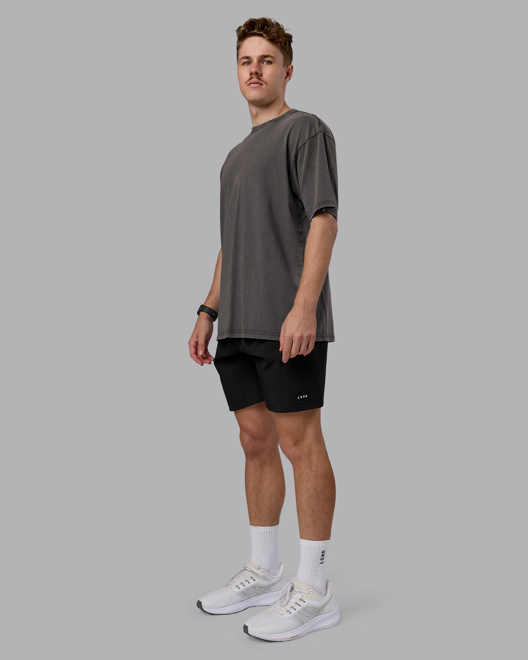 Man wearing Heart FLXCotton Oversized Tee - Washed Dark Storm-Violet Ray | Model:Cameron | Size:M