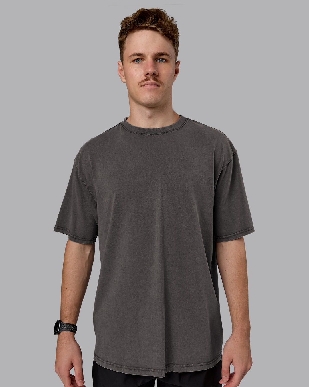 Man wearing Heart FLXCotton Oversized Tee - Washed Dark Storm-Violet Ray | Model:Cameron | Size:M